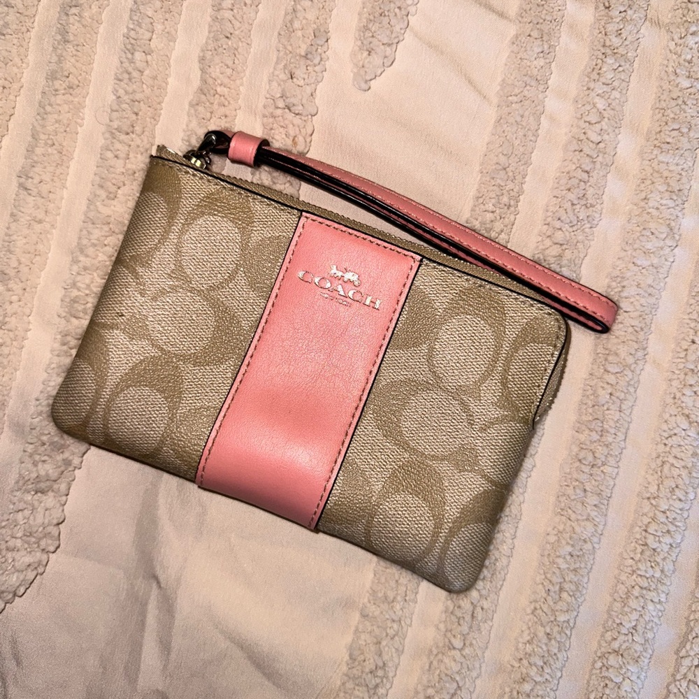 Small pink and beige coach wristlet